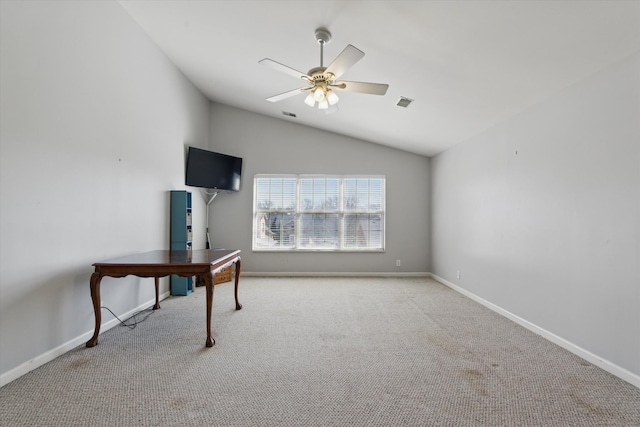 interior space with lofted ceiling, visible vents, baseboards, and ceiling fan