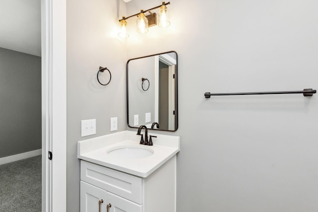 bathroom with baseboards and vanity