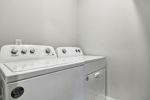 laundry room featuring independent washer and dryer and laundry area