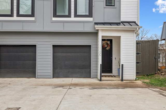 garage with concrete driveway