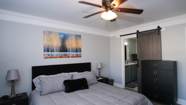 bedroom featuring a ceiling fan, a barn door, crown molding, and connected bathroom