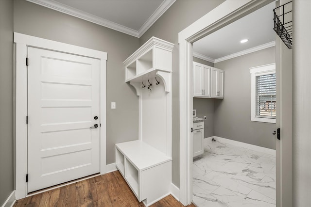 mudroom with crown molding, recessed lighting, baseboards, and marble finish floor