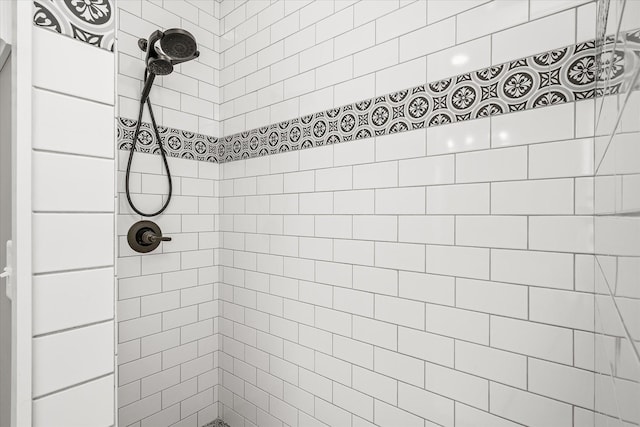 bathroom with a tile shower