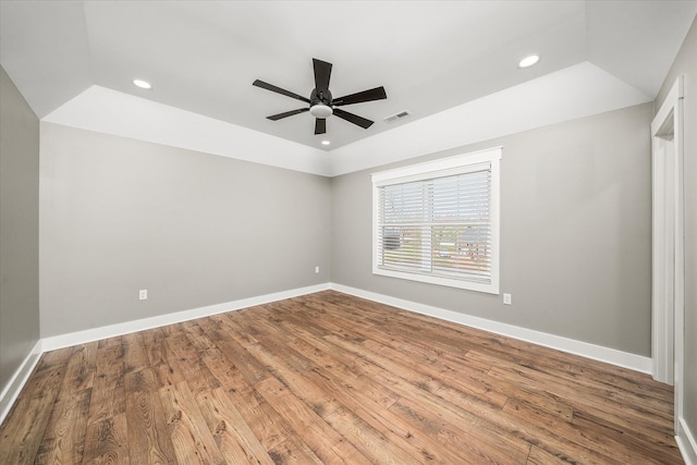 spare room with a ceiling fan, wood finished floors, baseboards, visible vents, and recessed lighting