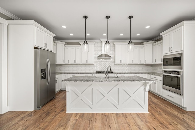 kitchen featuring white cabinets, appliances with stainless steel finishes, wall chimney exhaust hood, and a sink