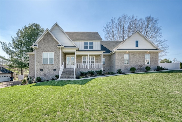 craftsman house with a front lawn, brick siding, covered porch, and crawl space