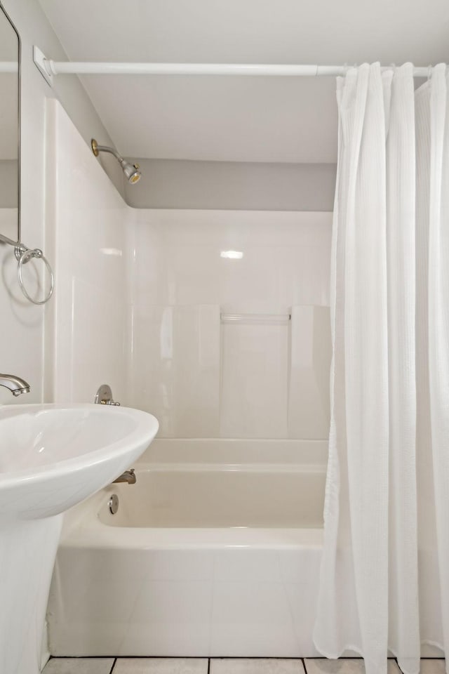 full bathroom featuring tile patterned floors and shower / tub combo with curtain