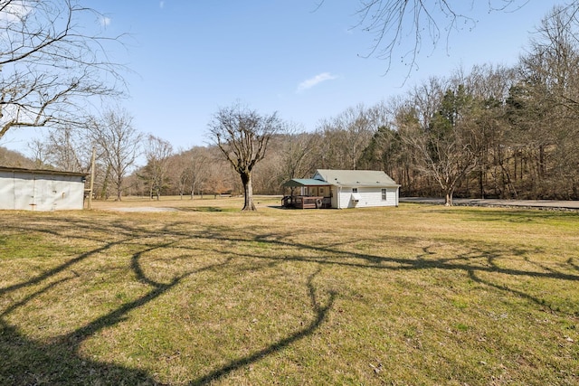 view of yard with a wooded view