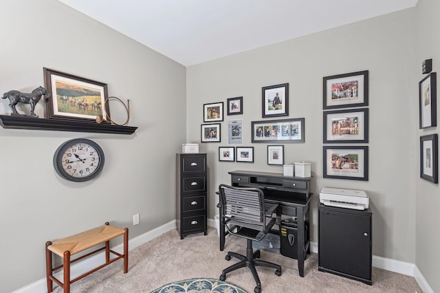 home office featuring baseboards and light carpet