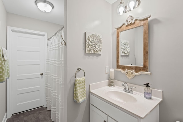 bathroom with tile patterned floors and vanity