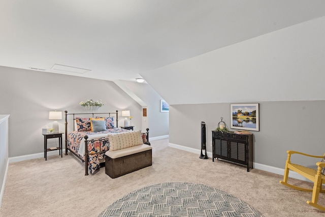 bedroom with lofted ceiling, carpet flooring, and baseboards