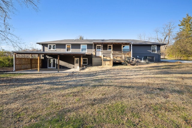 rear view of property featuring a deck