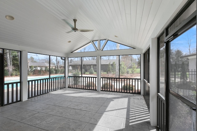 unfurnished sunroom featuring lofted ceiling, wooden ceiling, and ceiling fan