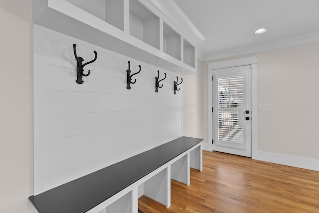 mudroom with light wood finished floors, recessed lighting, baseboards, and ornamental molding