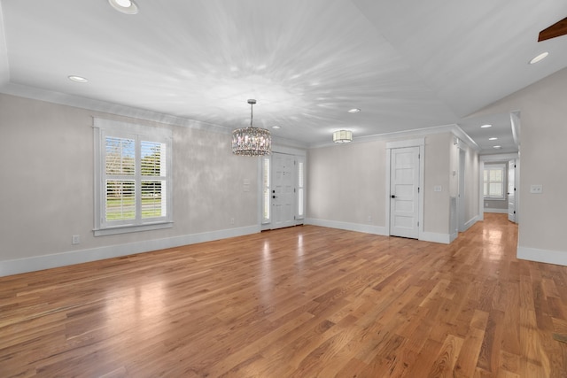 unfurnished living room featuring crown molding, light wood-style flooring, recessed lighting, and baseboards