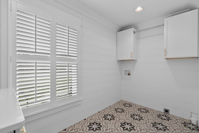 washroom featuring recessed lighting, cabinet space, hookup for an electric dryer, and wooden walls