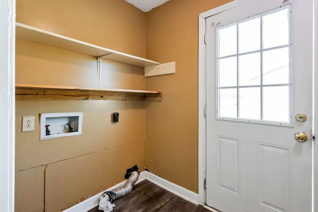 clothes washing area with washer hookup, laundry area, dark wood-style floors, and baseboards