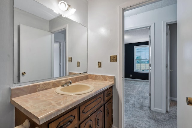 bathroom with baseboards and vanity