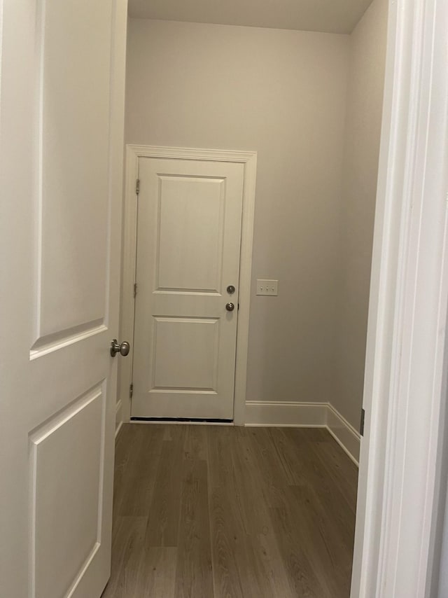 interior space featuring dark wood-style floors and baseboards