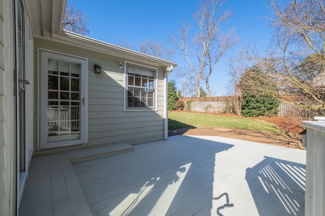 view of patio featuring a deck and fence