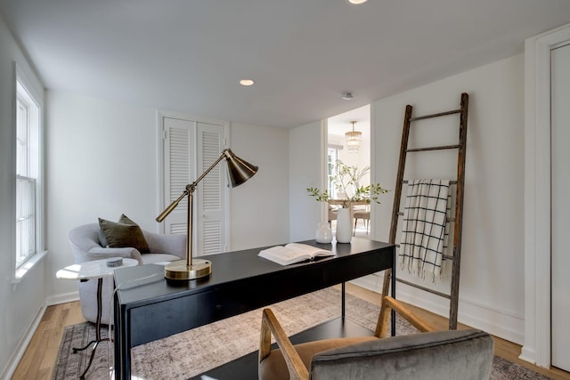 office area with recessed lighting, baseboards, and light wood finished floors