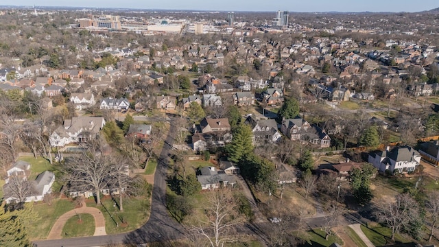 birds eye view of property with a residential view