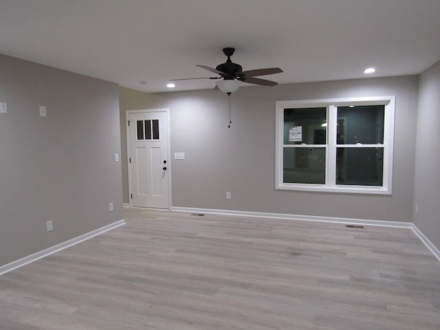 unfurnished room featuring recessed lighting, baseboards, light wood-style floors, and a ceiling fan