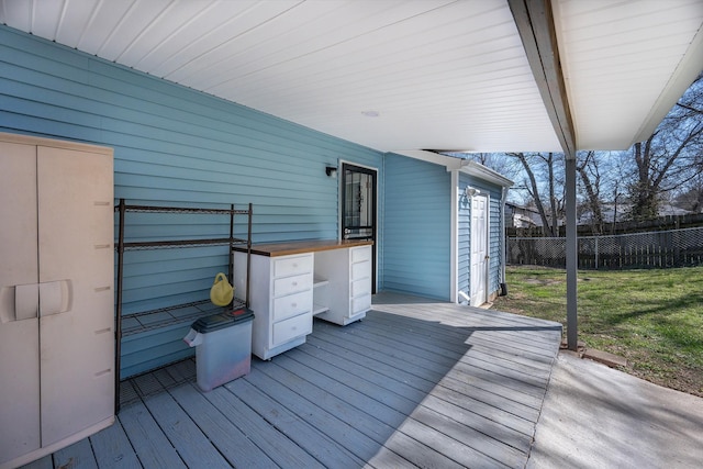 wooden terrace featuring fence