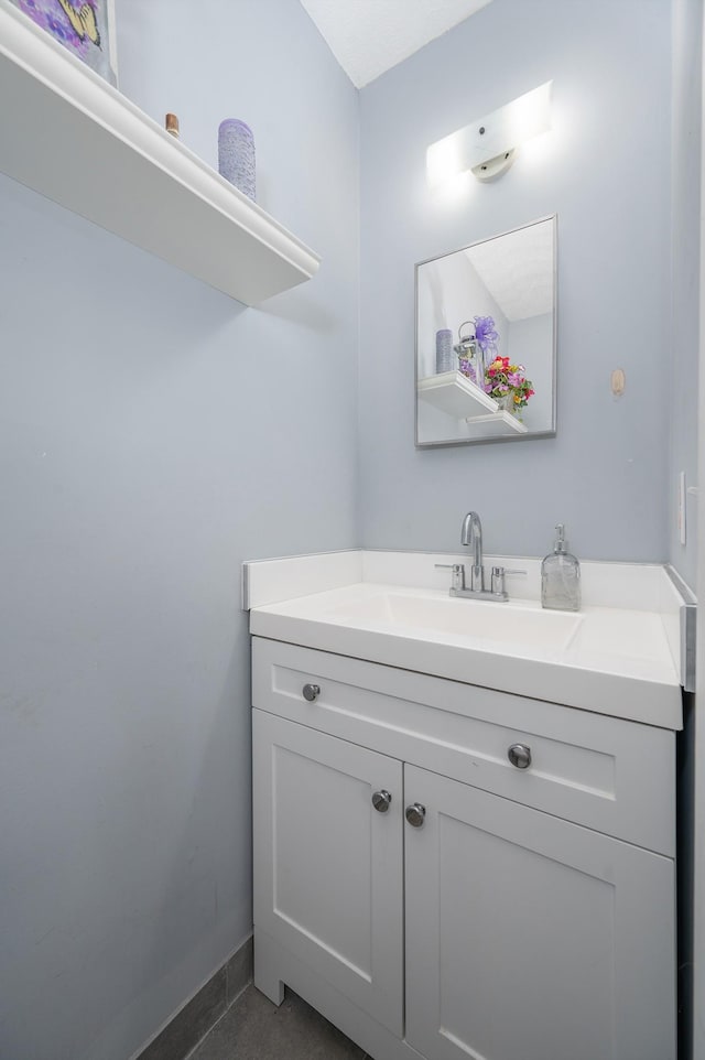 bathroom featuring vanity and baseboards