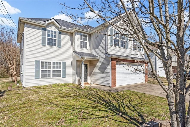 view of front of house featuring an attached garage, concrete driveway, and a front lawn