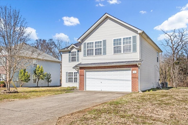 traditional-style house with a garage, brick siding, concrete driveway, and a front lawn