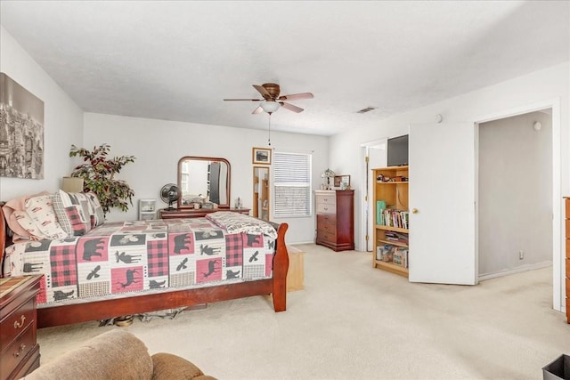 bedroom featuring visible vents, carpet floors, and ceiling fan