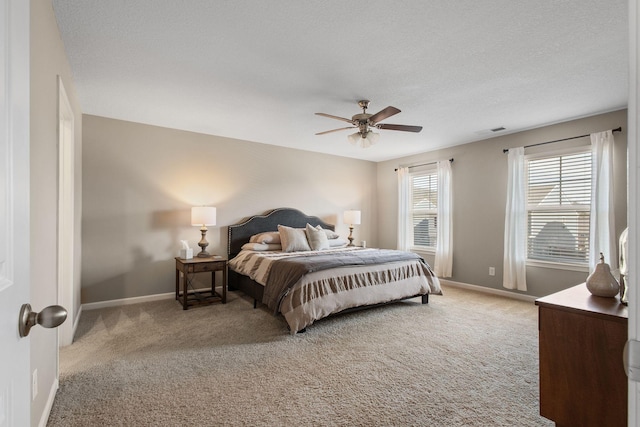 bedroom with visible vents, baseboards, and light colored carpet