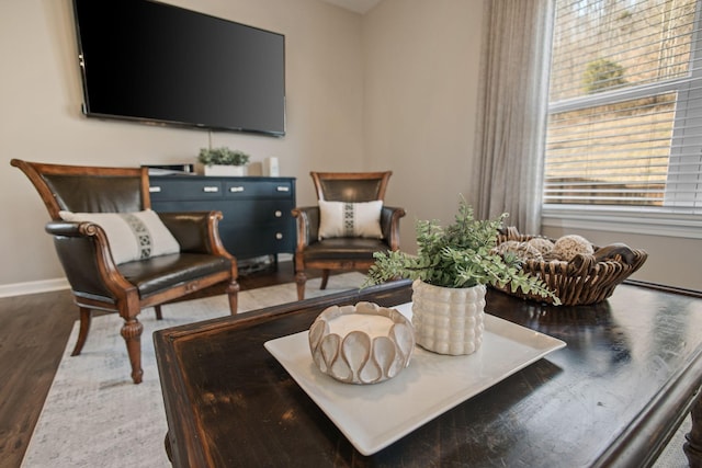 interior space featuring wood finished floors and baseboards