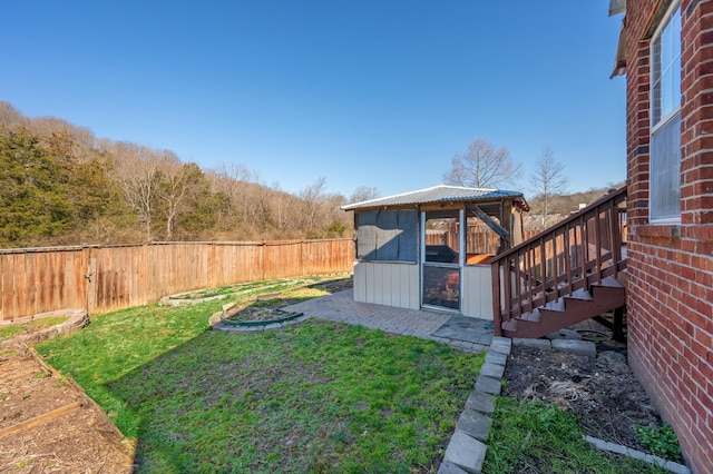 view of yard with an outbuilding and a fenced backyard