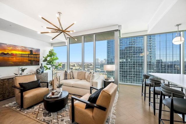 living area featuring a notable chandelier, a city view, and floor to ceiling windows