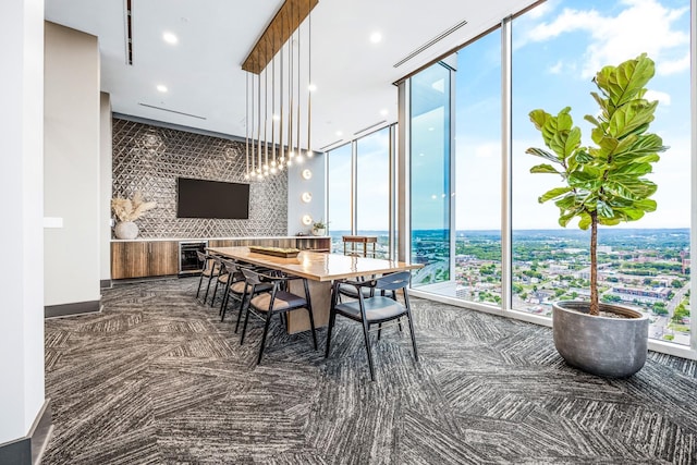 dining room with recessed lighting, visible vents, wine cooler, and floor to ceiling windows