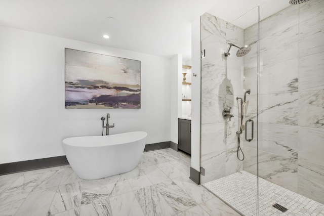 bathroom featuring vanity, a freestanding tub, marble finish floor, and a marble finish shower