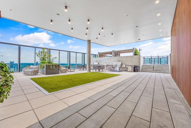 view of patio featuring a grill