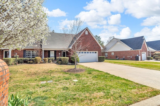 view of front facade with a garage, concrete driveway, a front lawn, and brick siding