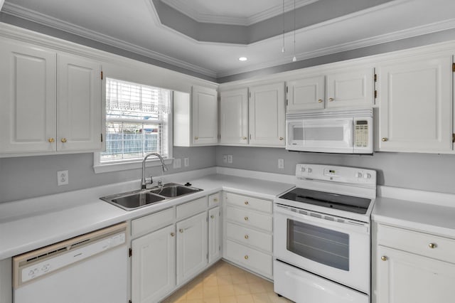 kitchen featuring a sink, ornamental molding, white cabinets, and white appliances