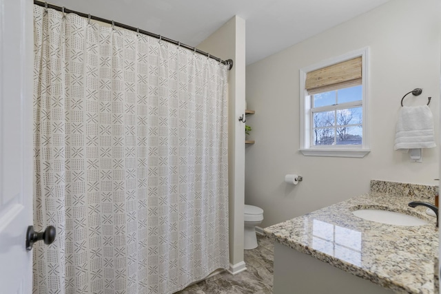 full bathroom featuring vanity and toilet