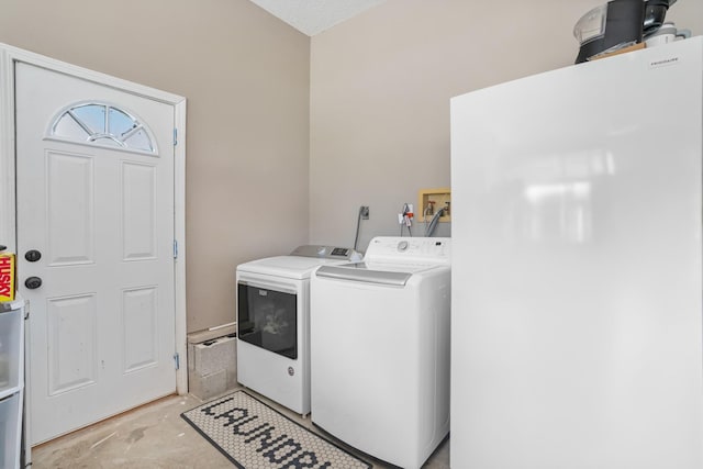 laundry room featuring washer and dryer and laundry area