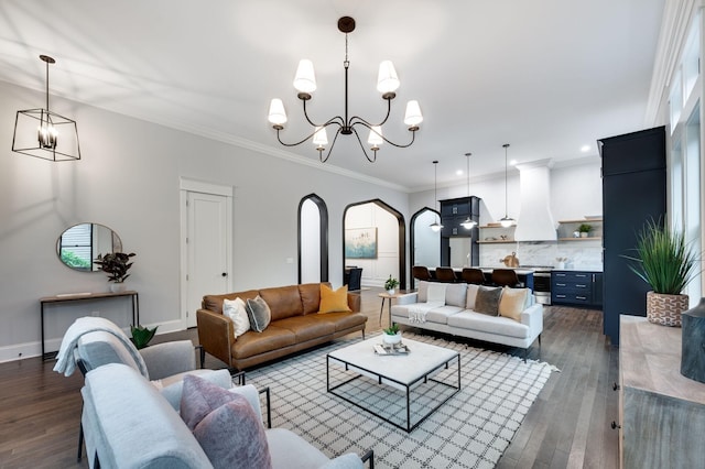 living area featuring arched walkways, a notable chandelier, crown molding, and dark wood-type flooring