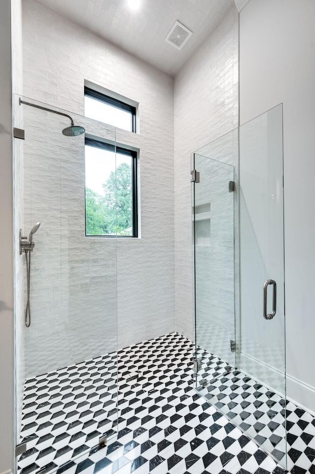 full bath featuring visible vents and a shower stall