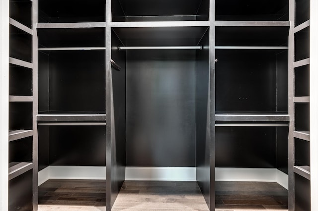 spacious closet with wood finished floors