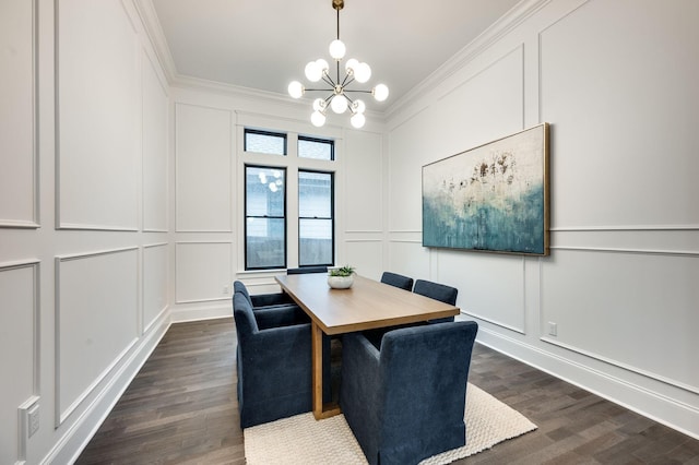 dining area with a chandelier, a decorative wall, dark wood-style floors, and ornamental molding