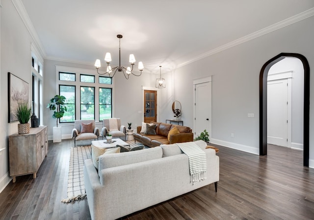 living area featuring baseboards, arched walkways, dark wood-style floors, and crown molding