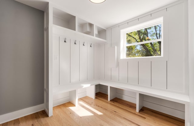 mudroom featuring light wood-type flooring and baseboards