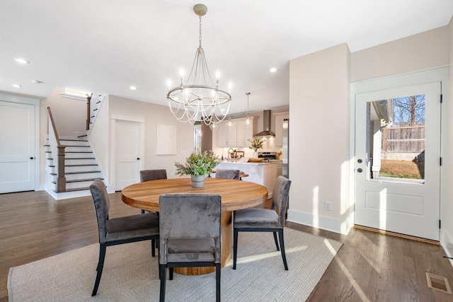 dining room with stairs, recessed lighting, wood finished floors, and visible vents